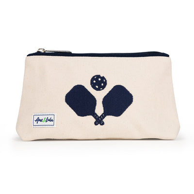 Front view of small natural canvas makeup pouch. Navy crossed paddles are embroidered on the front and navy trim on the zipper.