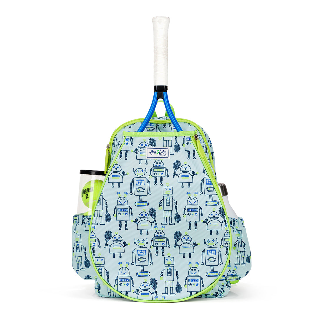 Front view of light blue kids tennis backpack with navy robots holding tennis racquets printed on the fabric. Front of backpack has a pocket for holding tennis racquets.