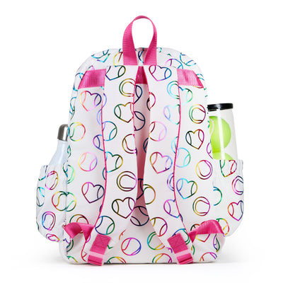 White kids tennis backpack with hot pink zippers and metallic rainbow tennis balls and hearts printed on the fabric.