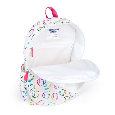 White kids tennis backpack with hot pink zippers and metallic rainbow tennis balls and hearts printed on the fabric.