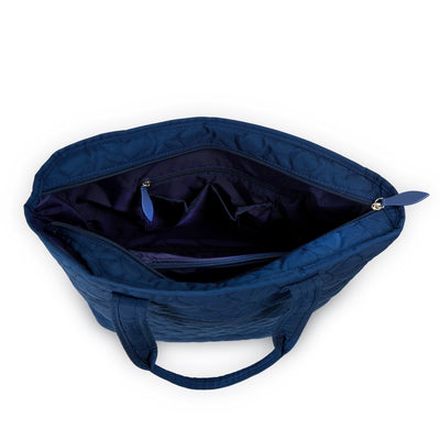 Navy nylon tennis tote with tennis ball quilted pattern.