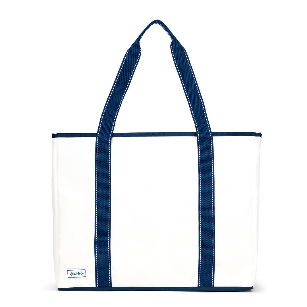 Front view of white nylon beach tote with navy straps and navy details