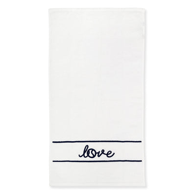 White terry towel laying flat on white background with navy stripes and the word love embroidered on it