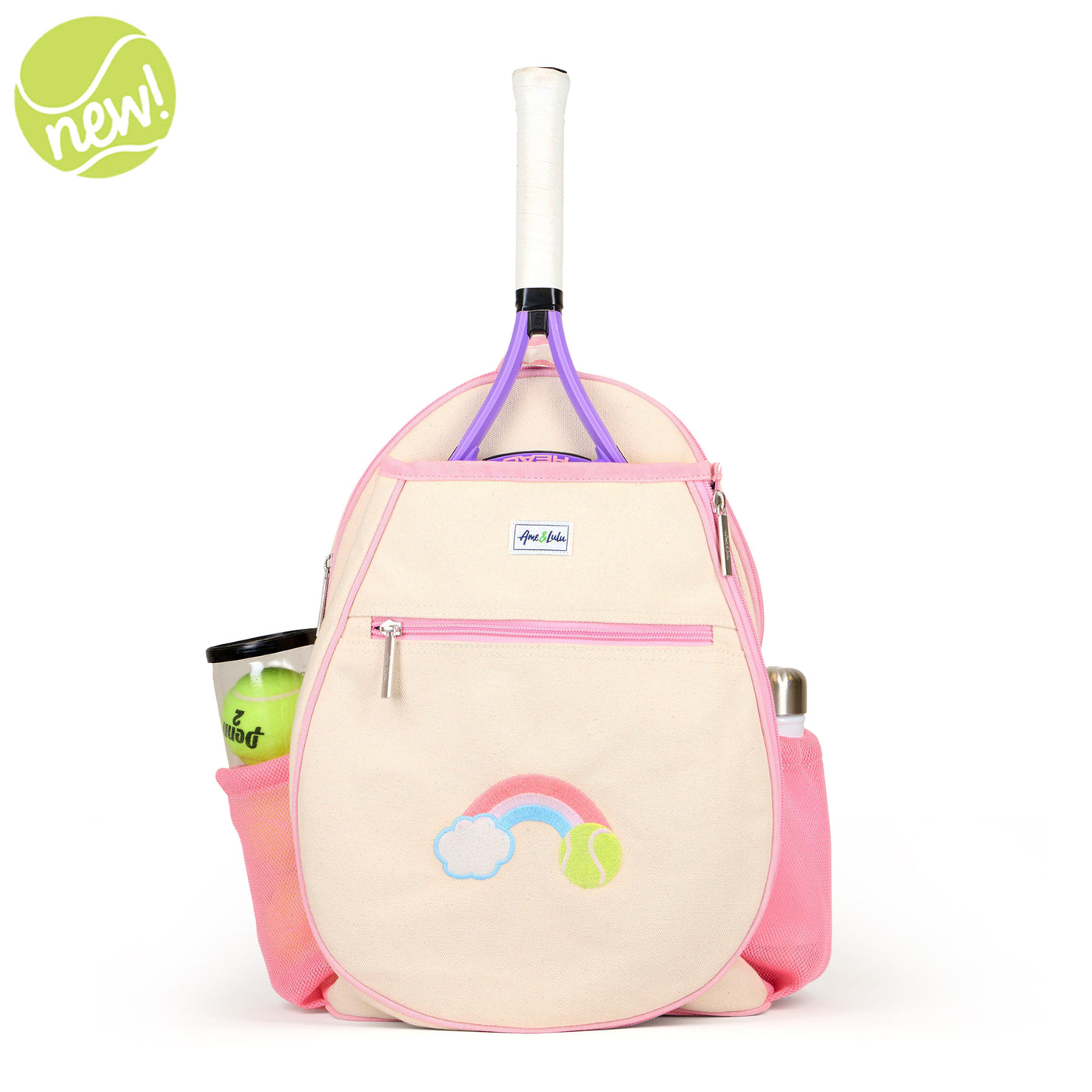 Natural canvas kids tennis backpack with pastel pink trim and water bottle pockets. There is a front tennis racquet pocket. A rainbow with a tennis ball is embroidered on the front pocket. 