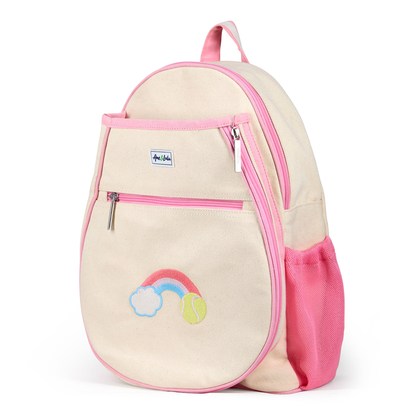 Natural canvas kids tennis backpack with pastel pink trim and water bottle pockets. There is a front tennis racquet pocket. A rainbow with a tennis ball is embroidered on the front pocket. 