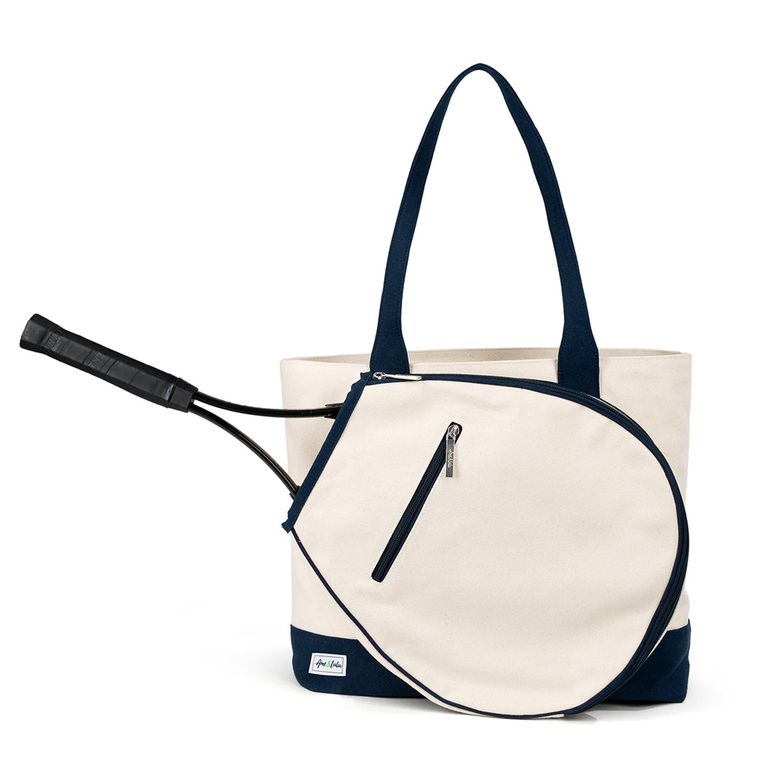 Front view of canvas tennis tote with navy straps and a front pocket for holding a tennis racquet