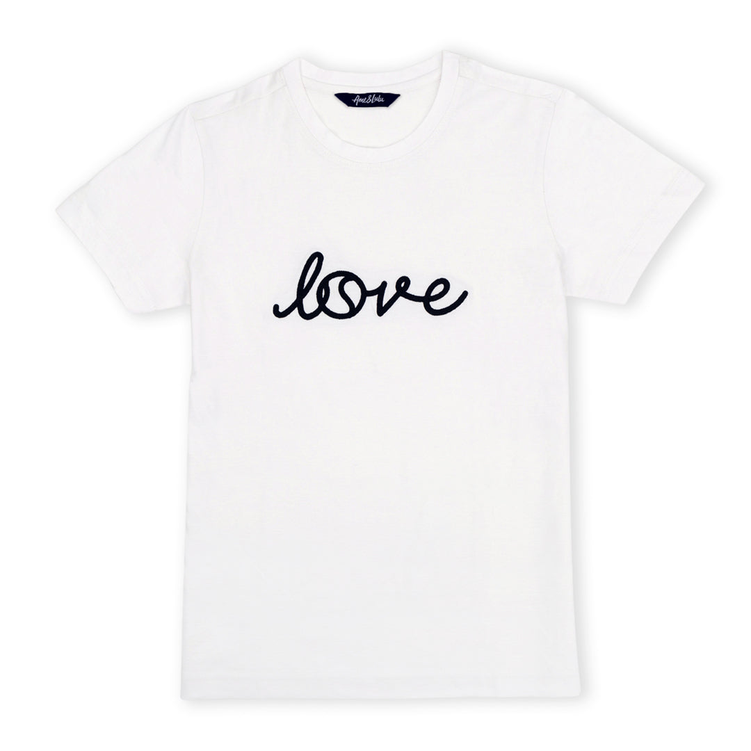 White short sleeve t-shirt lays flat on a white background with the word love embroidered on the front in a cursive font.